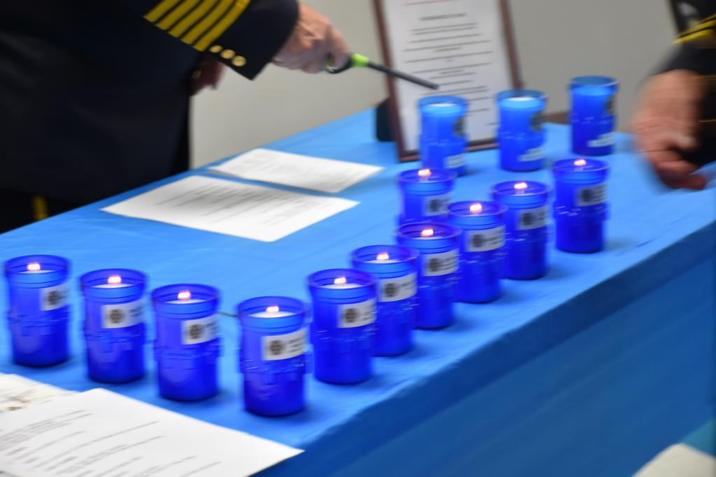 The Memorial Service begins with the lighting of the candles of those members who passed in 2021