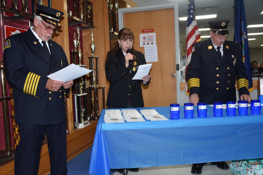 The necrology:  
Chiefs Butler (L) and Walters (R) read the names of our members while Pres. Edele followed with the reading of the family's names
