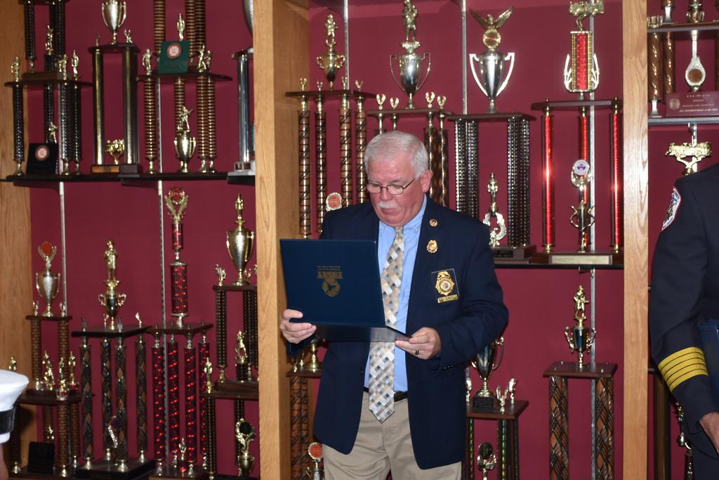 FASNY Director Don Farrell presents a Certificate of Recognition for the PCVFA's service to the Community
