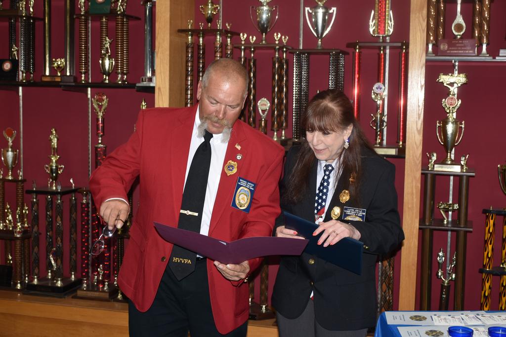Dutchess County Pres. Michael Carter presents Pres. Edele with a Certificate of Achievement for the PCVFA